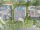 Aerial view of the home showcasing its mature landscaping, screened-in pool, and large lot at 142 Stone Hill Dr, Maitland, FL 32751