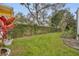 The serene backyard is fully fenced with lush greenery for ultimate privacy and a well-manicured lawn at 142 Stone Hill Dr, Maitland, FL 32751