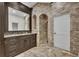 Bathroom featuring custom vanities, elegant finishes, and a spacious walk-in shower with unique stonework at 142 Stone Hill Dr, Maitland, FL 32751