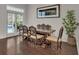 Bright dining room featuring a decorative table and chairs, with access to the outdoor pool area; great for entertaining at 142 Stone Hill Dr, Maitland, FL 32751