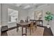 Charming dining room features hardwood flooring, a tray ceiling, and natural light at 142 Stone Hill Dr, Maitland, FL 32751