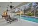 Pool area featuring patio with seating, lounge chairs and view of neighborhood at 142 Stone Hill Dr, Maitland, FL 32751