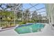 Enjoy this screened-in pool with blue tile accents, a waterfall feature, and beautiful landscaping at 142 Stone Hill Dr, Maitland, FL 32751