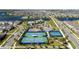 Aerial view of community tennis and basketball courts, plus clubhouse amenities in a vibrant residential neighborhood at 14366 Lanikai Beach Dr, Orlando, FL 32827