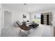 Bright and airy living room with modern furniture, neutral tones, and a large window at 1642 Laia Rd, Haines City, FL 33844