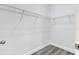 Walk-in closet featuring wire shelving, hard surface floors, white trim, and fresh paint at 16904 Sw 30Th Avenue Rd, Ocala, FL 34473
