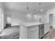 Bright kitchen with a central island, stainless steel dishwasher, and open floor plan concept at 16904 Sw 30Th Avenue Rd, Ocala, FL 34473