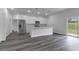 View of the kitchen with stainless steel appliances, kitchen island and view to outdoor space at 16904 Sw 30Th Avenue Rd, Ocala, FL 34473