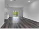 Open-concept living area with a stylish island, and bright sliding doors to the backyard at 16904 Sw 30Th Avenue Rd, Ocala, FL 34473