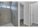 Walk-in shower featuring sleek tile work and a window offering natural light at 16904 Sw 30Th Avenue Rd, Ocala, FL 34473