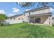 Spacious backyard and patio area perfect for outdoor entertaining and relaxation at 1702 Reflection Ln, St Cloud, FL 34771