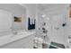 Modern bathroom featuring a glass shower, white vanity, and neutral color palette at 1702 Reflection Ln, St Cloud, FL 34771