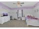 Charming bedroom with whimsical decorations, including playful artwork and a cozy bed setup at 1702 Reflection Ln, St Cloud, FL 34771