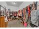 Large walk-in closet with extensive shelving, hanging racks, and ample storage space at 1702 Reflection Ln, St Cloud, FL 34771