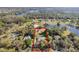 An aerial view of the property line showcases the pond, lot size, and mature landscaping at 17220 Countrybrook Ln, Orlando, FL 32820