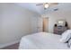 Clean bedroom with light colored carpet, white walls, and a ceiling fan at 17220 Countrybrook Ln, Orlando, FL 32820