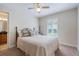 Cozy bedroom featuring soft carpet, a comfortable bed, and bright window at 17220 Countrybrook Ln, Orlando, FL 32820