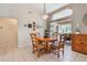 Dining room featuring a wooden table and chairs and access to the outdoor patio at 17220 Countrybrook Ln, Orlando, FL 32820