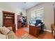 Dedicated home office boasts built-in shelving and a spacious desk for productivity at 17220 Countrybrook Ln, Orlando, FL 32820