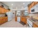 Kitchen with granite countertops and a view of the dining and breakfast nook at 17220 Countrybrook Ln, Orlando, FL 32820