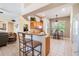 Well-lit kitchen featuring a breakfast bar and stainless steel appliances at 17220 Countrybrook Ln, Orlando, FL 32820