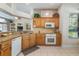 Kitchen with wood cabinets, granite countertops and modern appliances at 17220 Countrybrook Ln, Orlando, FL 32820