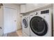 Convenient laundry room with modern washer and dryer units and storage cabinets at 17220 Countrybrook Ln, Orlando, FL 32820