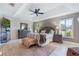 Spacious main bedroom features a tray ceiling, a ceiling fan, and lots of natural light at 17220 Countrybrook Ln, Orlando, FL 32820