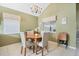 Cozy dining room with natural light and a chandelier at 1751 Meadowgold Ln, Winter Park, FL 32792