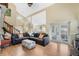 Vaulted living room with tile floors, a fireplace, and access to other living spaces at 1751 Meadowgold Ln, Winter Park, FL 32792