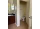 Bathroom featuring a toilet, vanity and tile flooring at 178 Chippendale Ter, Oviedo, FL 32765
