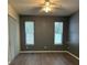 Neutral bedroom with window and ceiling fan providing ample natural light and ventilation at 178 Chippendale Ter, Oviedo, FL 32765