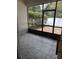 Enclosed patio with gray tiled flooring and brick paved outdoor living space at 178 Chippendale Ter, Oviedo, FL 32765