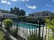 Inviting fenced pool with clear water offers a relaxing outdoor oasis near lush landscaping and beautiful homes at 178 Chippendale Ter, Oviedo, FL 32765