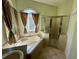 Bathroom featuring a shower and garden tub with tiled backsplash and trim at 1923 Willow Wood Dr, Kissimmee, FL 34746