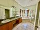 Bathroom featuring a garden tub, separate shower, dual sinks, and a spacious layout at 1923 Willow Wood Dr, Kissimmee, FL 34746