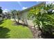 Charming home exterior with lush green lawn and mature trees at 1923 Willow Wood Dr, Kissimmee, FL 34746