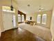 Inviting living room with neutral paint, tile entry, and abundant natural light at 1923 Willow Wood Dr, Kissimmee, FL 34746