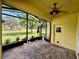 Enclosed patio offers views of the expansive lawn and neighborhood at 1923 Willow Wood Dr, Kissimmee, FL 34746