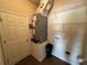 Utility room featuring a washer/dryer hookup and shelving for storage at 1923 Willow Wood Dr, Kissimmee, FL 34746