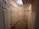Spacious walk-in closet with ample shelving for organized storage at 1923 Willow Wood Dr, Kissimmee, FL 34746
