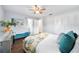 Bright bedroom with hardwood floors, a large window, a ceiling fan, and a closet at 2311 Ashland Blvd, Orlando, FL 32808