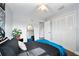 A bright bedroom with a ceiling fan and a spacious closet offers functional comfort at 2311 Ashland Blvd, Orlando, FL 32808