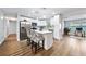 Bright kitchen with stainless steel appliances, a center island, and a breakfast bar at 2311 Ashland Blvd, Orlando, FL 32808