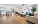 Open-concept living area with modern decor, a ceiling fan, and seamless flow into the kitchen and dining spaces at 2311 Ashland Blvd, Orlando, FL 32808