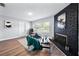 Cozy room with a black brick fireplace, hardwood floors, and a comfortable seating area at 2311 Ashland Blvd, Orlando, FL 32808