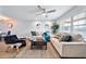 Bright and airy living room with a ceiling fan, lots of natural light, and stylish decor at 2311 Ashland Blvd, Orlando, FL 32808