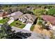 Beautiful aerial view showcasing the property, landscaped yard, and neighborhood at 24515 Bocage Way, Leesburg, FL 34748