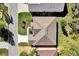 Aerial perspective showcasing roof, landscaping, and surrounding neighborhood streets at 24515 Bocage Way, Leesburg, FL 34748