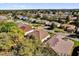 Aerial view of property showcasing the backyard, roof, and surrounding neighborhood at 24515 Bocage Way, Leesburg, FL 34748